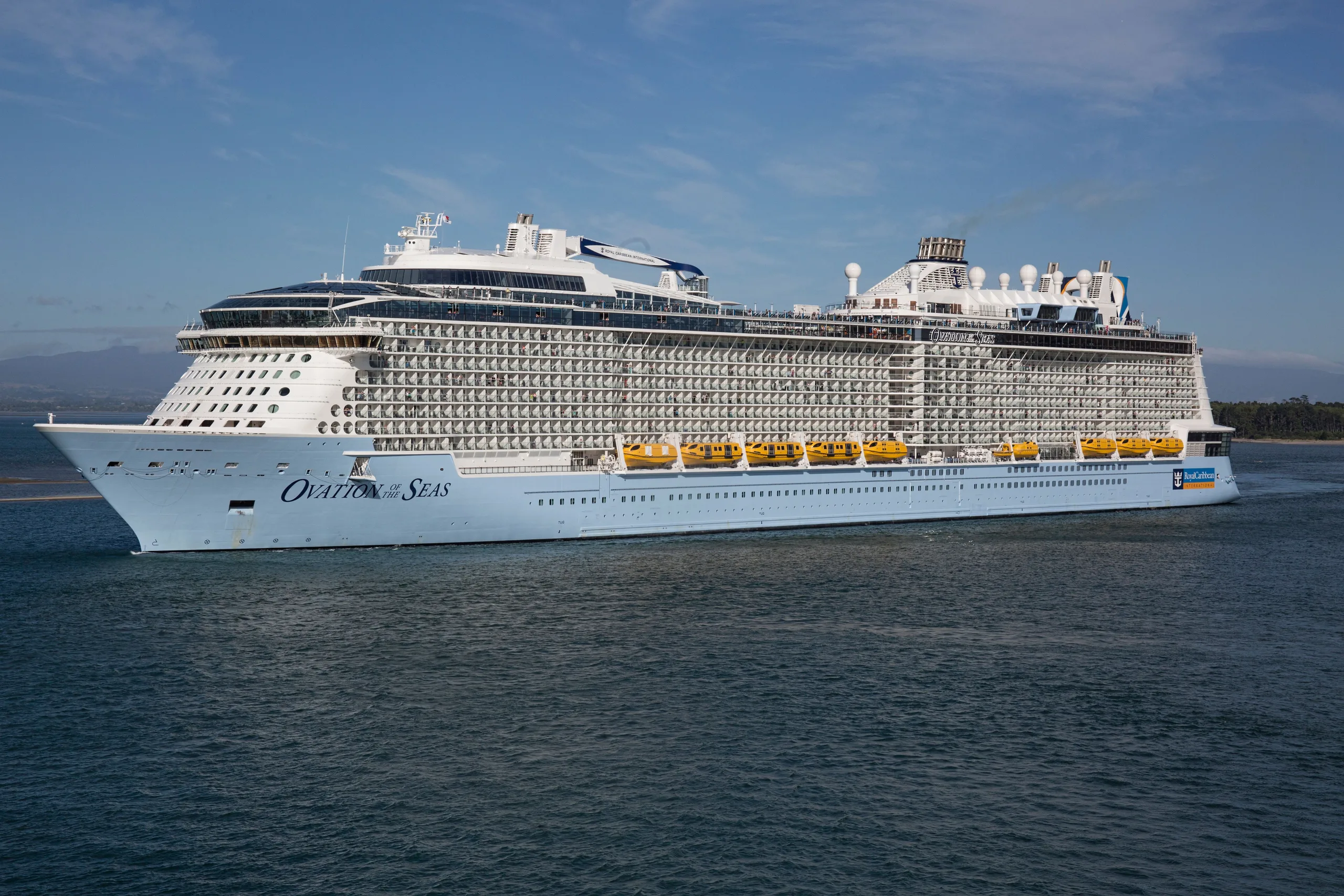 Majestic view of Ovation of the Seas cruise ship sailing on open water,