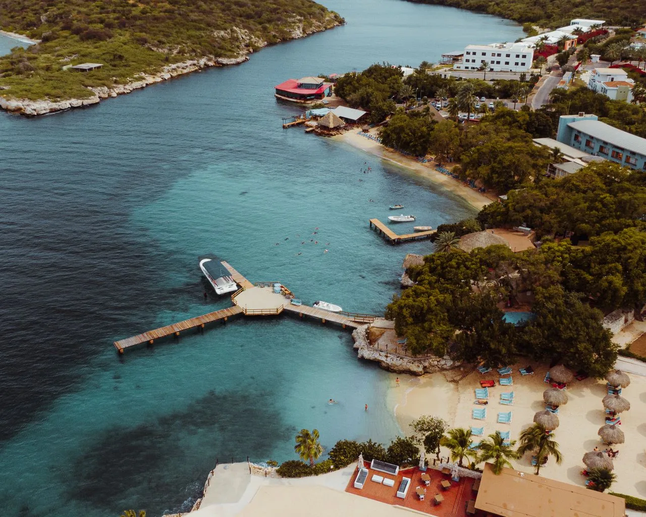 Explore the stunning coastline and crystal-clear waters in Curacao from above. Perfect vacation destination.