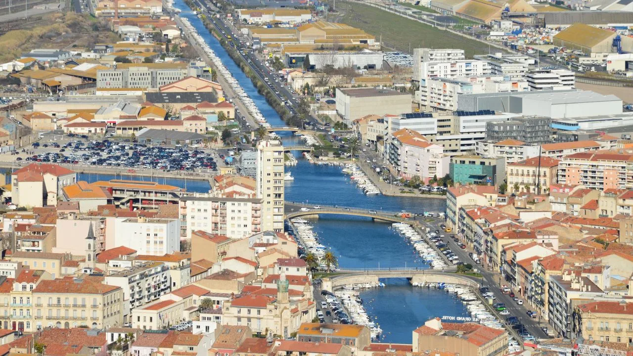 Stunning aerial shot of Sète with canals and cityscape in sunny weather.