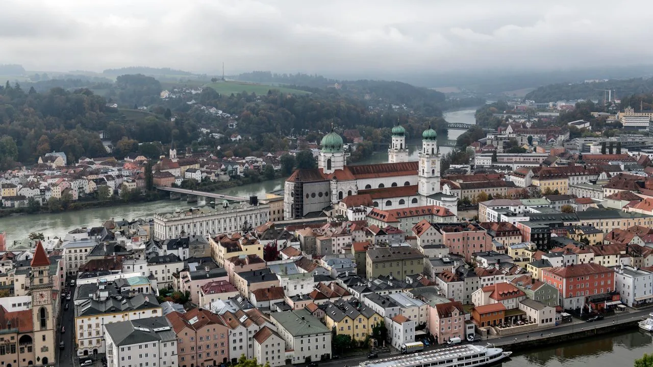 Scenic aerial view of Passau, Bavaria showcasing beautiful architecture by the rivers.