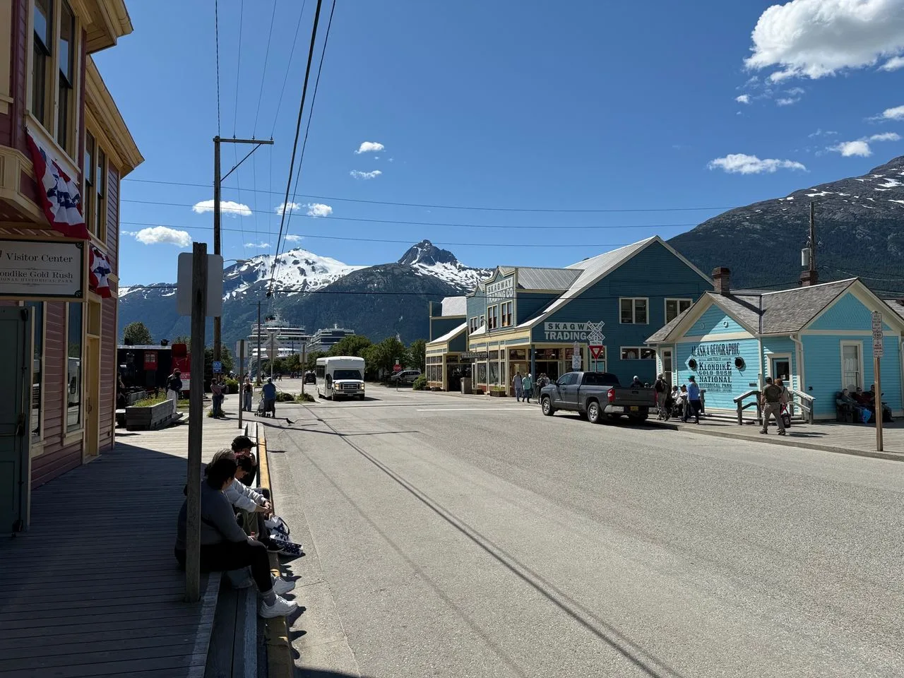 Explore Skagway, Alaska with mountain views, local shops, and a lively street scene.